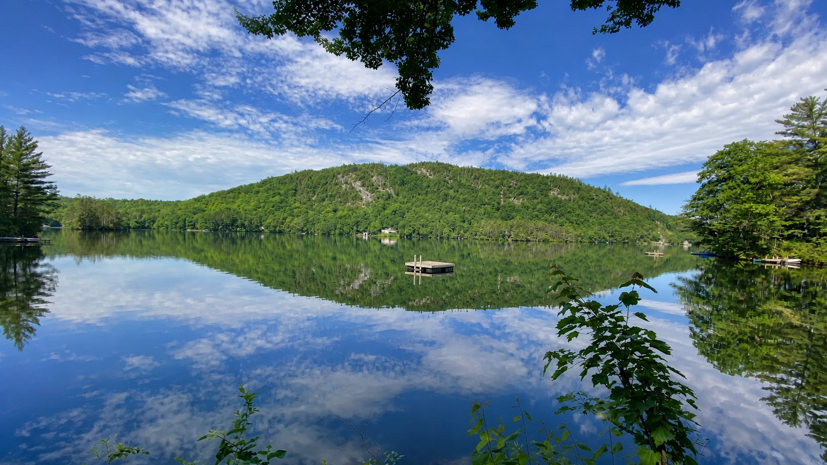 Lake Christopher reflecting Mount Christopher and a blue summer sky